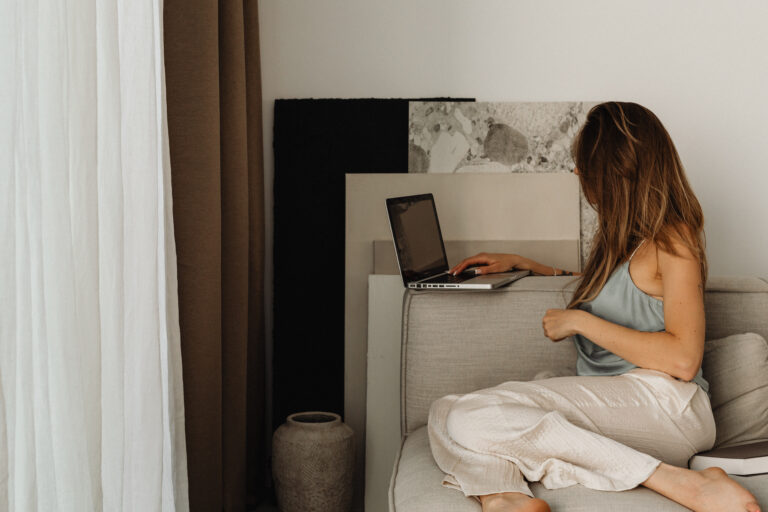 Female business owners working on a social media strategy at home on a laptop